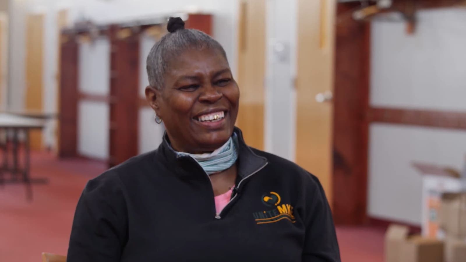 A smiling UniteWI community health worker